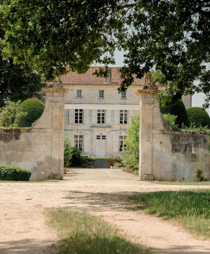 A photo of an entry gate to an ancient white building