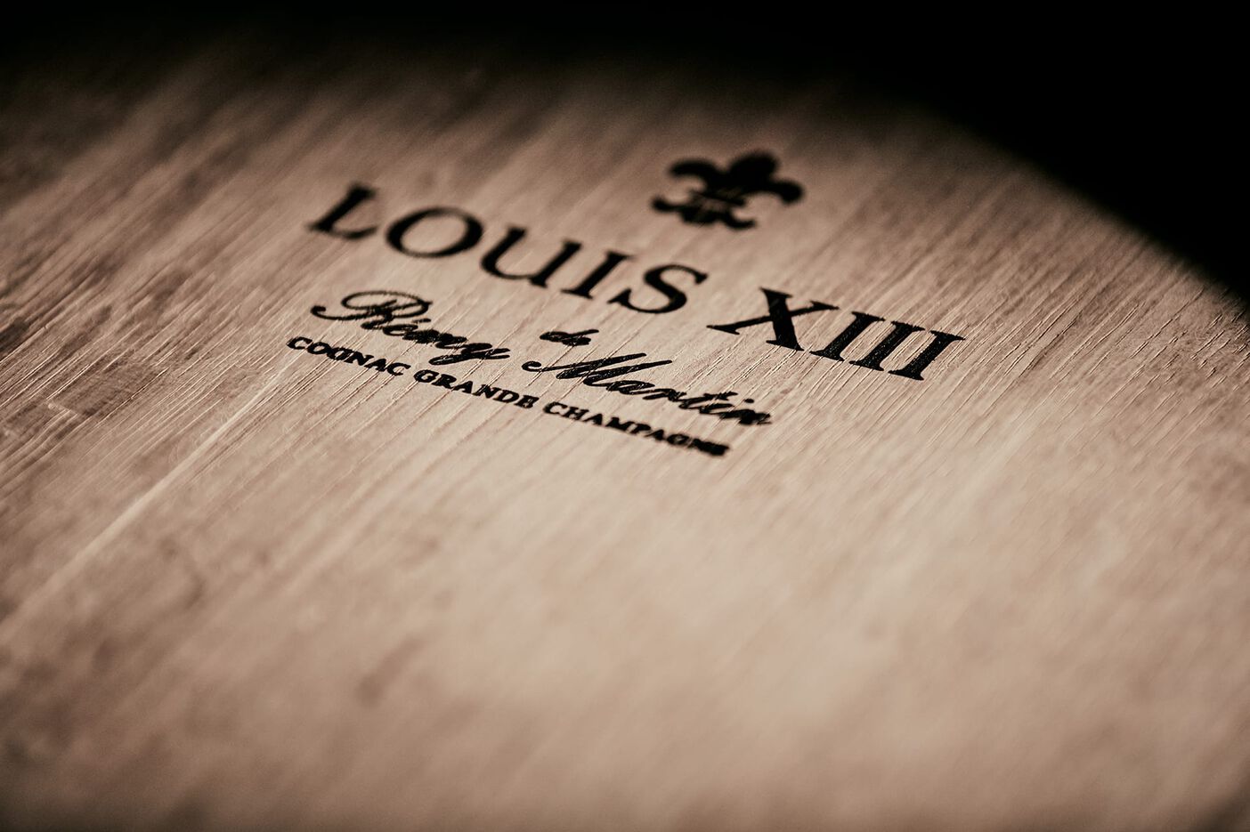 A photo of a wooden surface with inscription LOUIS XIII
