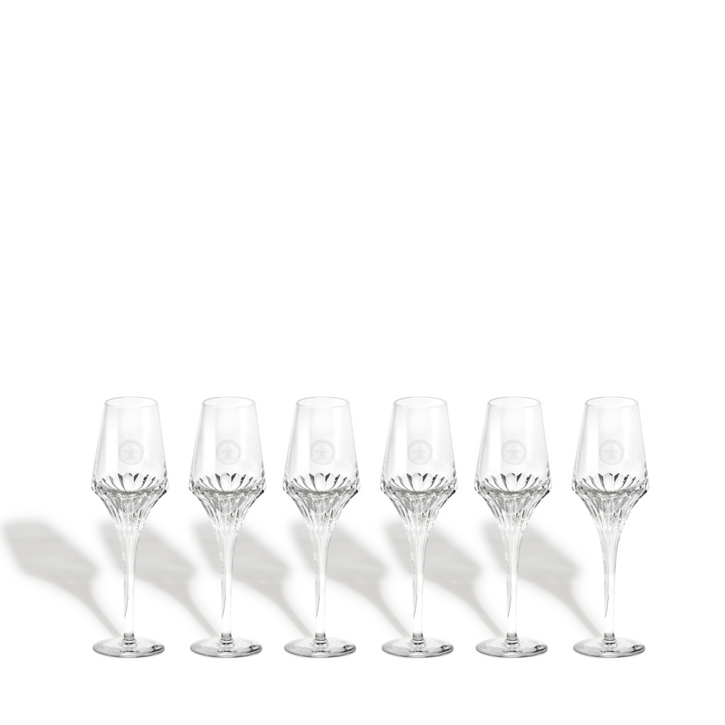 A packstot of six LOUIS XIII crystal glasses on a white background